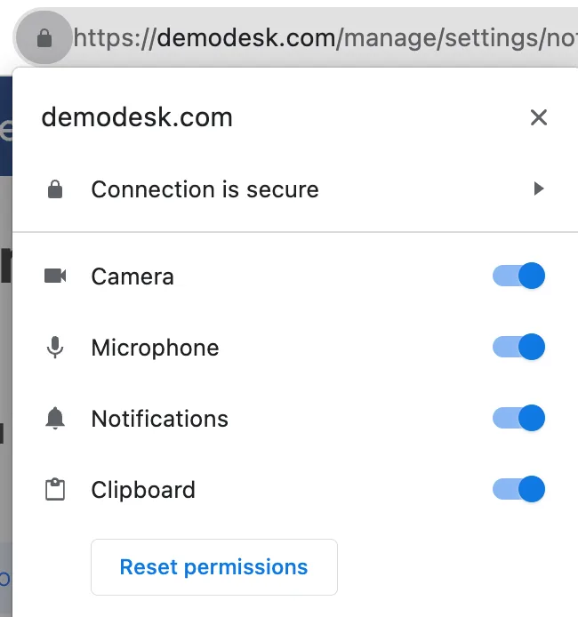 Browser site permissions popup for demodesk.com with camera, microphone, notifications and clipboard enabled