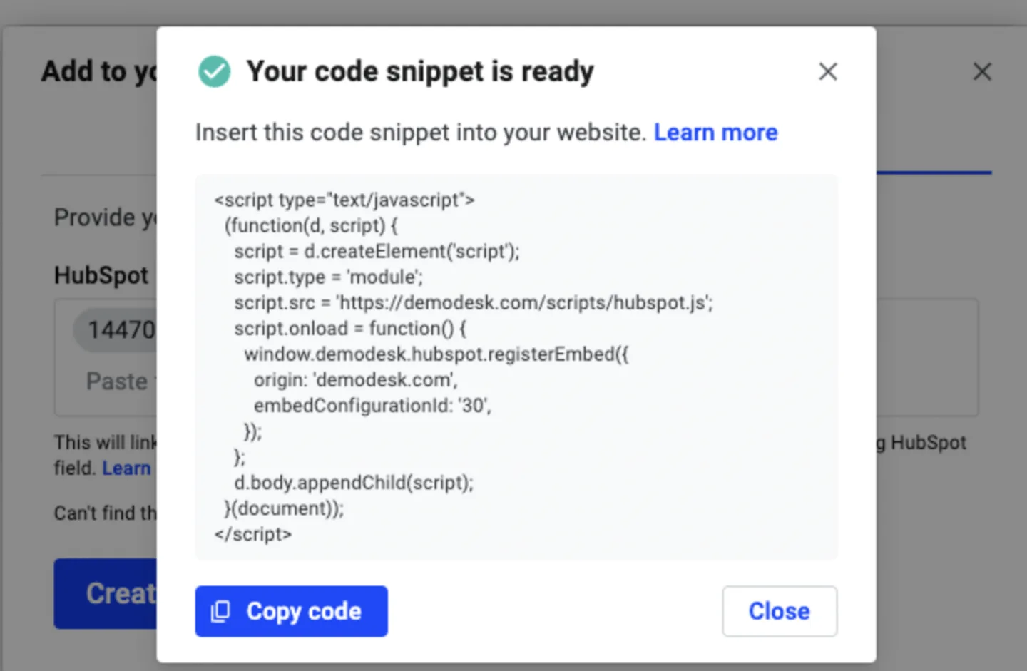 Code snippet ready dialog showing the generated HubSpot embed script and Copy code button